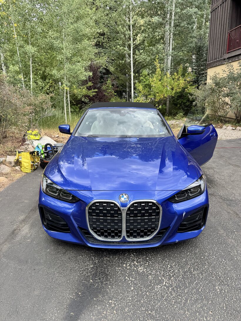 Blue BMW 4 Series detailed outside a Vail home