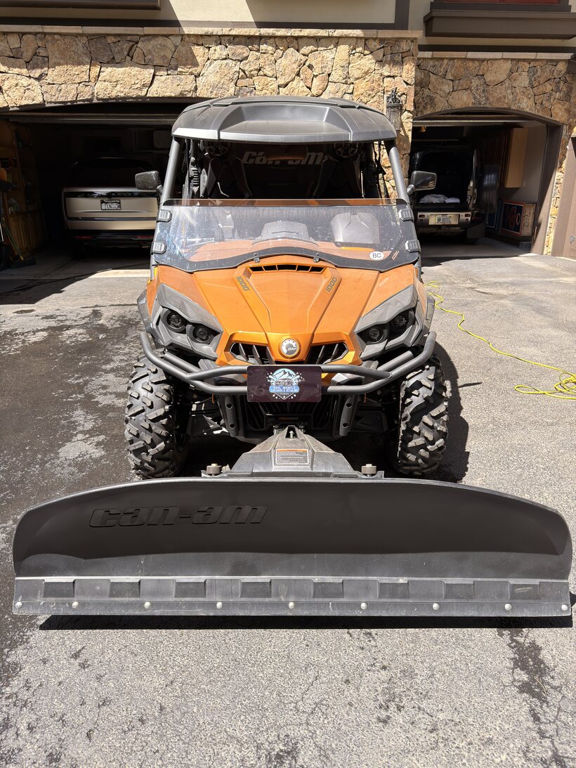 Orange Can-Am off-road UTV cleaned up