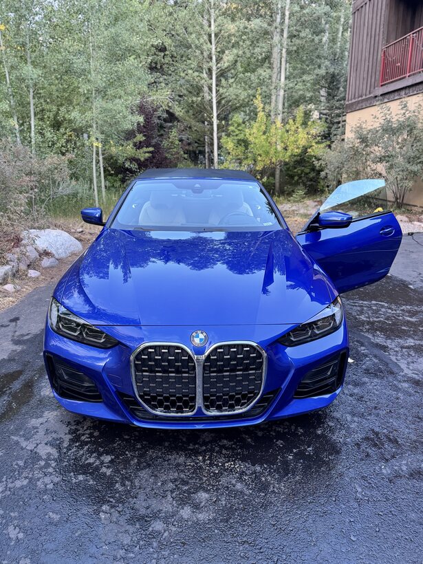 Blue BMW 4 Series detailed outside a Vail home