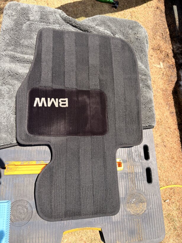 BMW floor mat shampooed and deep cleaned