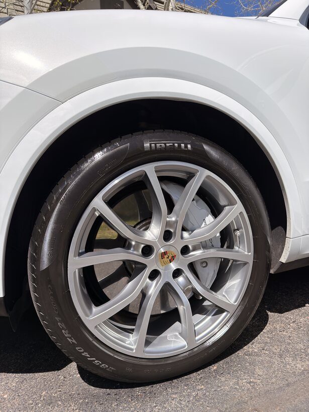 Detailed Porsche wheel with clean Pirelli tire